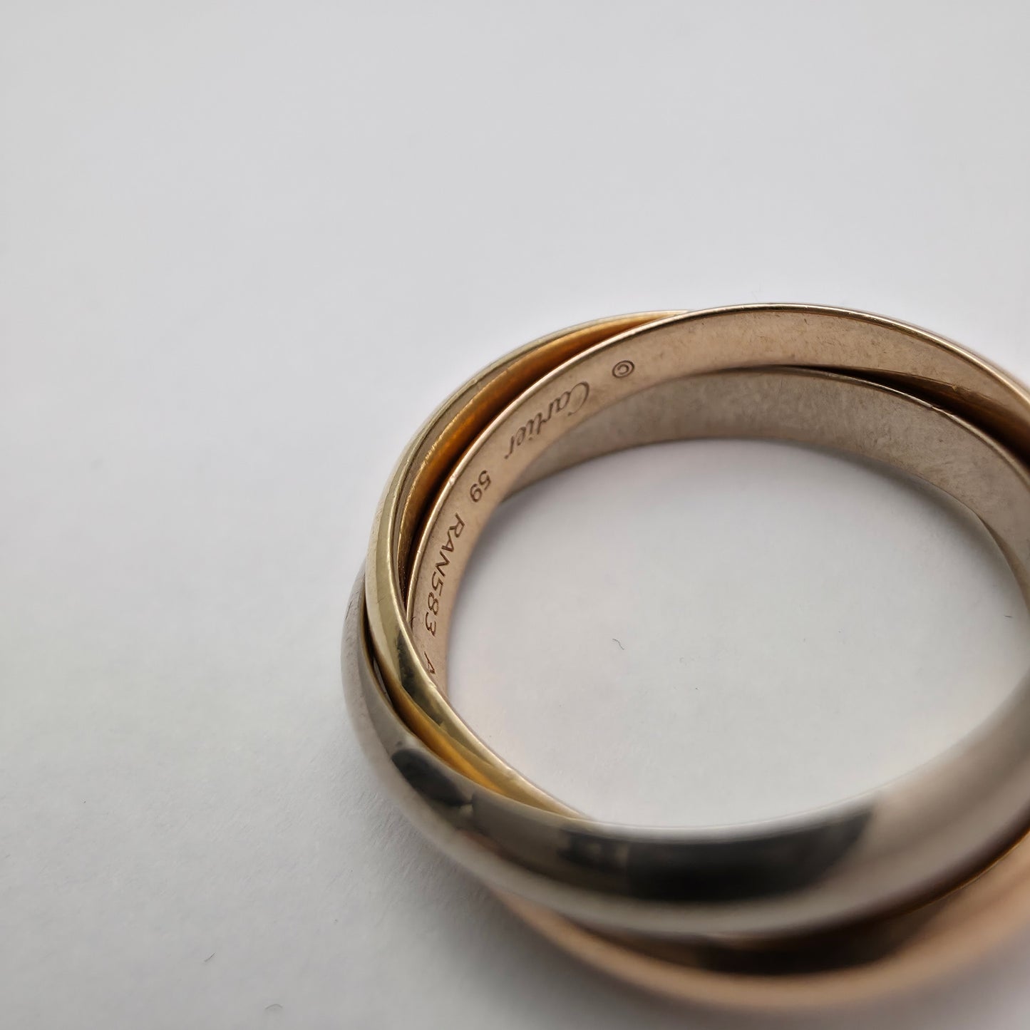 Zlati prstan "Cartier Trinity ring classic 18K 750/1000 + Pt 950/1000; masa=9.80g